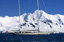 SY "Adele", 180 foot Hoek Design, motoring past Half Moon Island, Half Moon Bay, Antarctica, January 2007 Non editorial uses must be cleared individually.