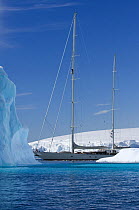 SY "Adele", 180 foot Hoek Design, motoring past icebergs in Wilhelmina Bay, Antarctica, January 2007  Non editorial uses must be cleared individually.