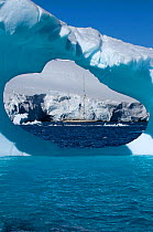 SY "Adele", 180 foot Hoek Design, seen in the distance through an ice window motoring in the Lemair Channel, Antarctica, January 2007 Non editorial uses must be cleared individually.