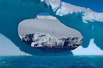 SY ^Adele^, 180 foot Hoek Design, seen in the distance through an ice window motoring in the Lemair Channel, Antarctica, January 2007 Non editorial uses must be cleared individually.