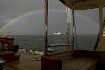 A rainbow arcs over a cruise ship near Port Stanley, Falkland Islands, January 2007
