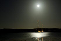 Moonlight shines on SY "Adele", 180 foot Hoek Design, anchored near Port Stanley, Falkland Islands, January 2007 Non editorial uses must be cleared individually.
