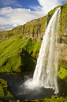 Seljandsjoss waterfall, South Iceland. Note person in foreground for scale.
