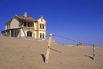 Derelict house in Kolmanskop, a deserted diamond mining town, Namib desert, Namibia