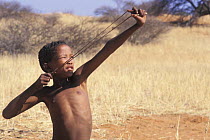 Young Bushman San with catapult, Bushmanland, Namibia