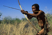 Bushman hunter with traditional bow, Bushmanland, Namibia