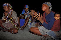 During a religious ritual the bushman women clap the rhythm and sing power songs, Bushmanland, Namibia