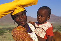 Herero woman with child, Kaokoland, Namib desert, Namibia