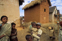 People in Betsileo village with reeds for thatching, Highlands, Madagascar