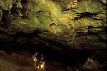 Two people in the entrance to Cathedral Cave, Ankarana Special Reserve, Madagascar