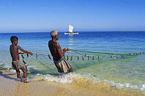 Vezo fishermen in lagoon pulling nets, West Madagascar