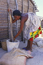 Woman crushing salt in Vezo village, West Madagascar