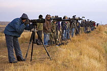 Photographers with cameras on tripods ready to photograph birds in Bosque del Apache National Wildlife Refuge, New Mexico, USA