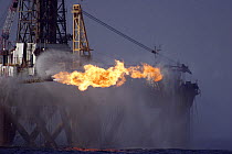 The oil rig J.W McLean flares off gas during drilling operations in the North Sea, September 2006