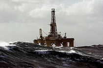 The oil rig J.W McLean buffeted by rough waves during a gale in the North Sea, September 2006