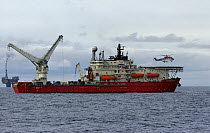 A crew helicopter lands on the helideck of the dive support vessel C.S.O Wellservicer, North Sea, September 2007