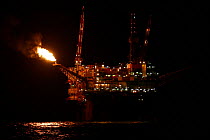 The oil rig Ninian Southern, situated 90 miles east of the Shetland Islands, flares off gas during drilling operations in the North Sea, September 2007