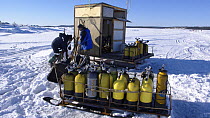 Oxygen cylinders for divers ice diving under ice in the White Sea, Northern Russia