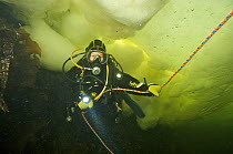 Ice diver under ice in the White sea, Northern Russia