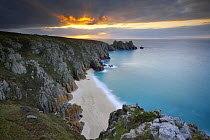 Sunrise at Porthcurno, looking down at the beach from the top of the cliffs, Cornwall, England, UK. Long time exposure
