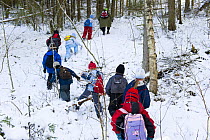 A group of Estonian school children in the woods learning about nature, Tartumaa, Estonia