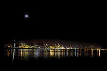 Liverpool Waterfront on the River Mersey at night with moon above, Merseyside, December 2007