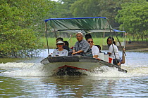 Tourists travelling by boat in Tortuguero National Park, Costa Rica