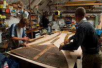 Shipwrights working with templates in Win Cnoops' Slipway Co-operative workshop. Underfall Yard, Bristol Floating Harbour, UK. July 2008, Model Released