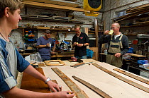 Shipwrights taking a tea break and working with templates in Win Cnoops' Slipway Co-operative workshop. Underfall Yard, Bristol Floating Harbour, UK. July 2008
