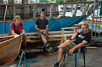 Shipwrights taking a tea break at the Underfall Boatyard. Bristol Floating Harbour, England. July 2008, Model Released