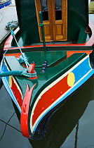 Colourful bow of narrow boat in the rain. Bristol Floating Harbour, UK