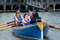 Bristol Pilot Gig Club's Men's crew practicing in their gig "Isambard" on Bristol's Floating Harbour, UK. July 2008, Model Released