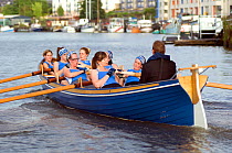 Bristol Pilot Gig Club's Ladies crew practicing in their gig "Isambard" on Bristol Floating Harbour, England, UK. July 2008, Model Released