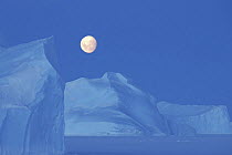 Moon (almost full) rising over antarctic landscape, Antarctica