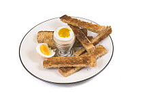 Soft Boiled Egg in egg cup, with toast soldiers
