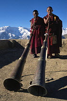 Buddhist monks blowing their horns at the Likir festival, Ladakh, Kashmir, India