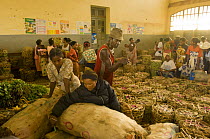 Traders waiting in Manakara railway station with goods, Madagascar