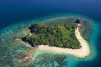 Aerial view of  the island of Nosy Tanikely with sandy beach on one side and rocky coast on the other, near Nosy Be, North Madagascar.