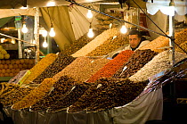 Tradesman selling dates, apricots and various nuts and pulses in the "Jemaa el Fna" square, Marrakech, Morocco, North Africa