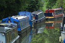 Boats moored in Brassknocker Basin near the junction with the Kennet and Avon Canal at Dundas Aqueduct, Wiltshire, England