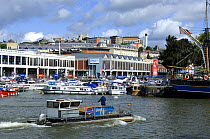 A maintainance barge working at the Bristol Harbour Festival, August 2008, with Bristol city skyline in background