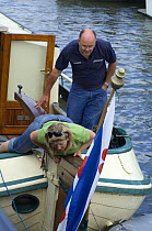 Boat owners making adjustments to their mooring at the Bristol Harbour Festival, August 2008