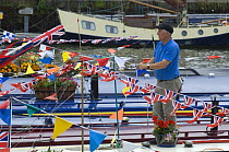 Narrowboat owner hangs out flags at the Bristol Harbour Festival, August 2008