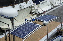 Solar panels on a cabin cruiser, Bristol floating harbour, UK