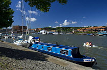 Narrowboat moored at Baltic Wharf, with Hotwells in the background. Bristol Harbour, UK