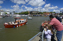 Spectators at the Bristol Harbour Festival watch as Bristol Ferryboat Company ferry passes. August 2008