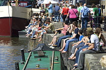 Spectators sitting on the quayside at the Bristol Harbour Festival, August 2008
