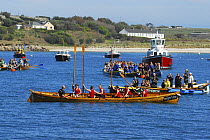 Falmouth Ladies A celebrating their world title by raising their paddles at the 19th World Pilot Gig Championships, Isles of Scilly, May 2008