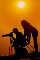 Silhouette of Igor Shpilenok and hi  wife Laura Williams on photoshoot, Bryansk province, Russia