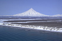 Snow-covered Kronotsky volcano and the Pacific Coast, Kronotsky Zapovednik, Kamchatka, Far East Russia